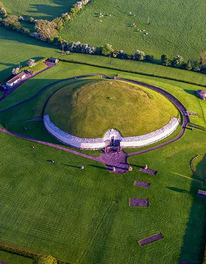 Aerial view of Newgrange with its white quartz facade in the Boyne Valley